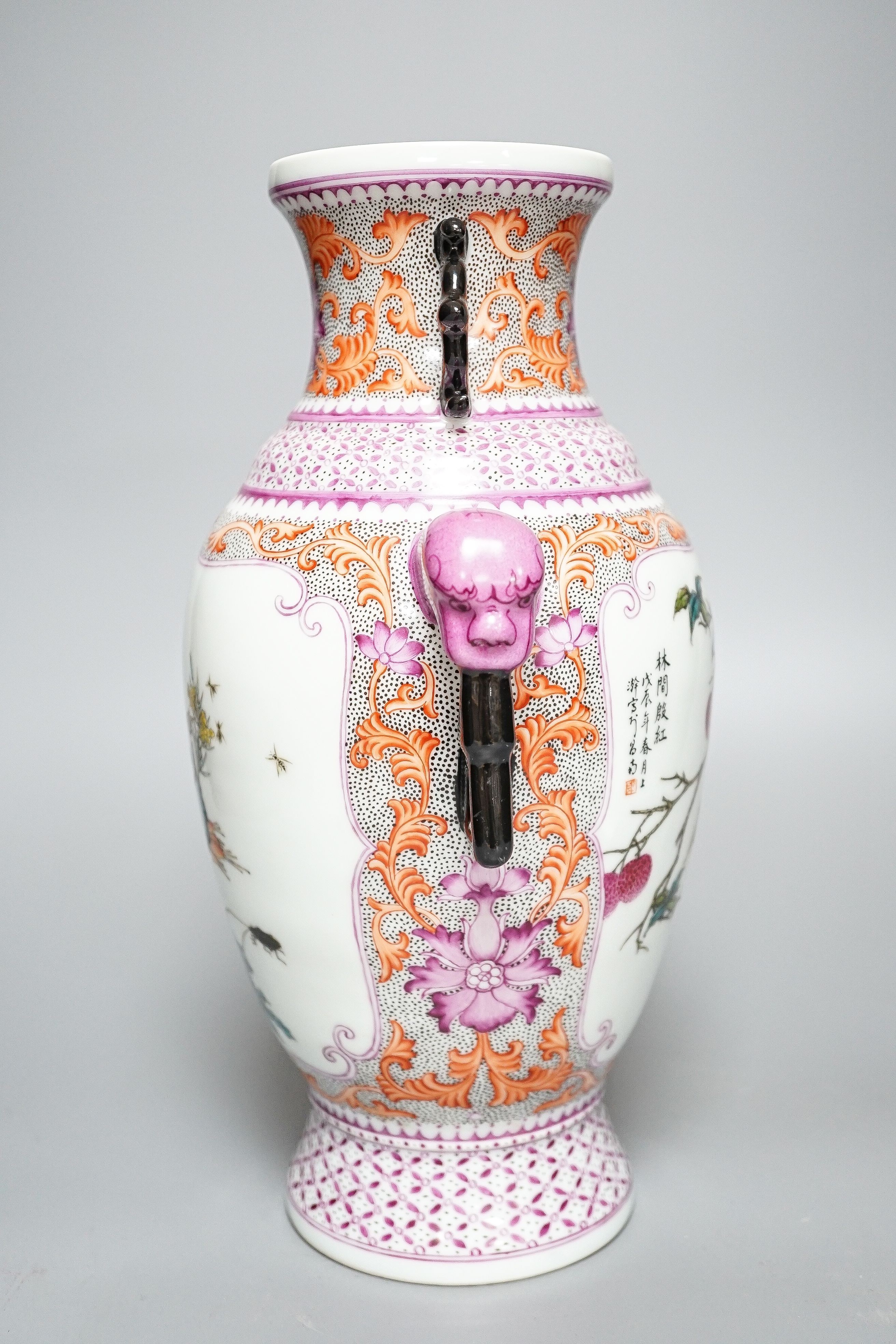 A Chinese porcelain famille rose two handled vase, Hongxian mark, 30cm